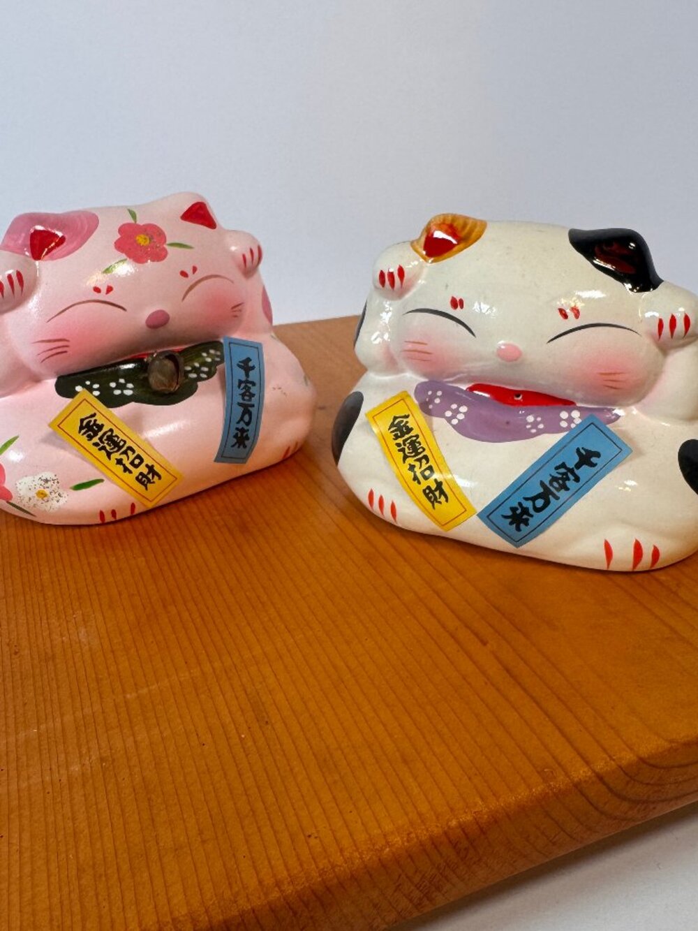 Meneki-neko style Japanese lucky cat.  Sold as a set, one pink and one white